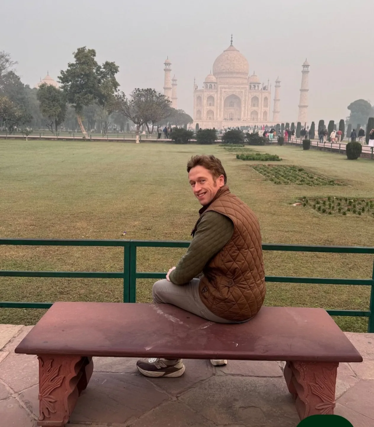 A visitor enjoying a view of the Taj Mahal