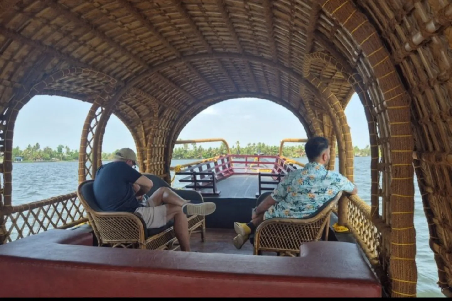 Travellers relaxing aboard a traditional covered boat