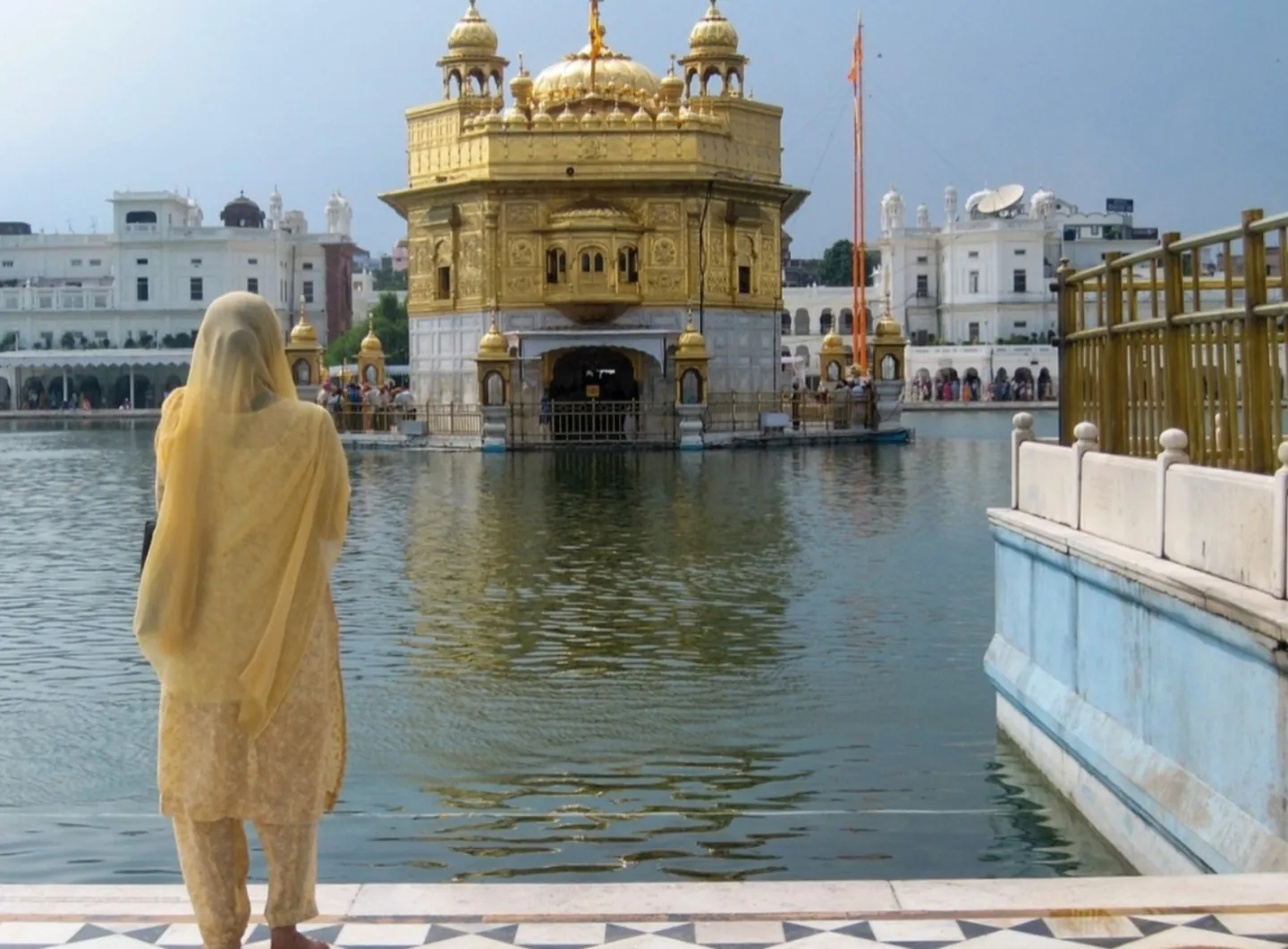 A visitor beside the Golden Temple in Amritsar