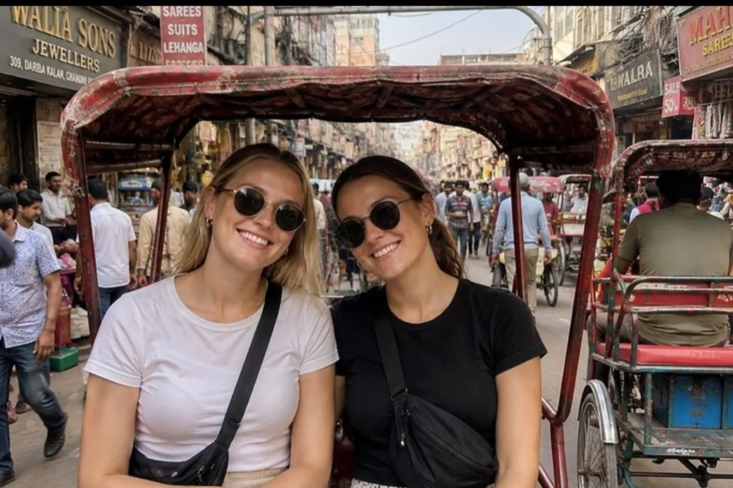 Travellers enjoying a cycle rickshaw ride in Old Delhi