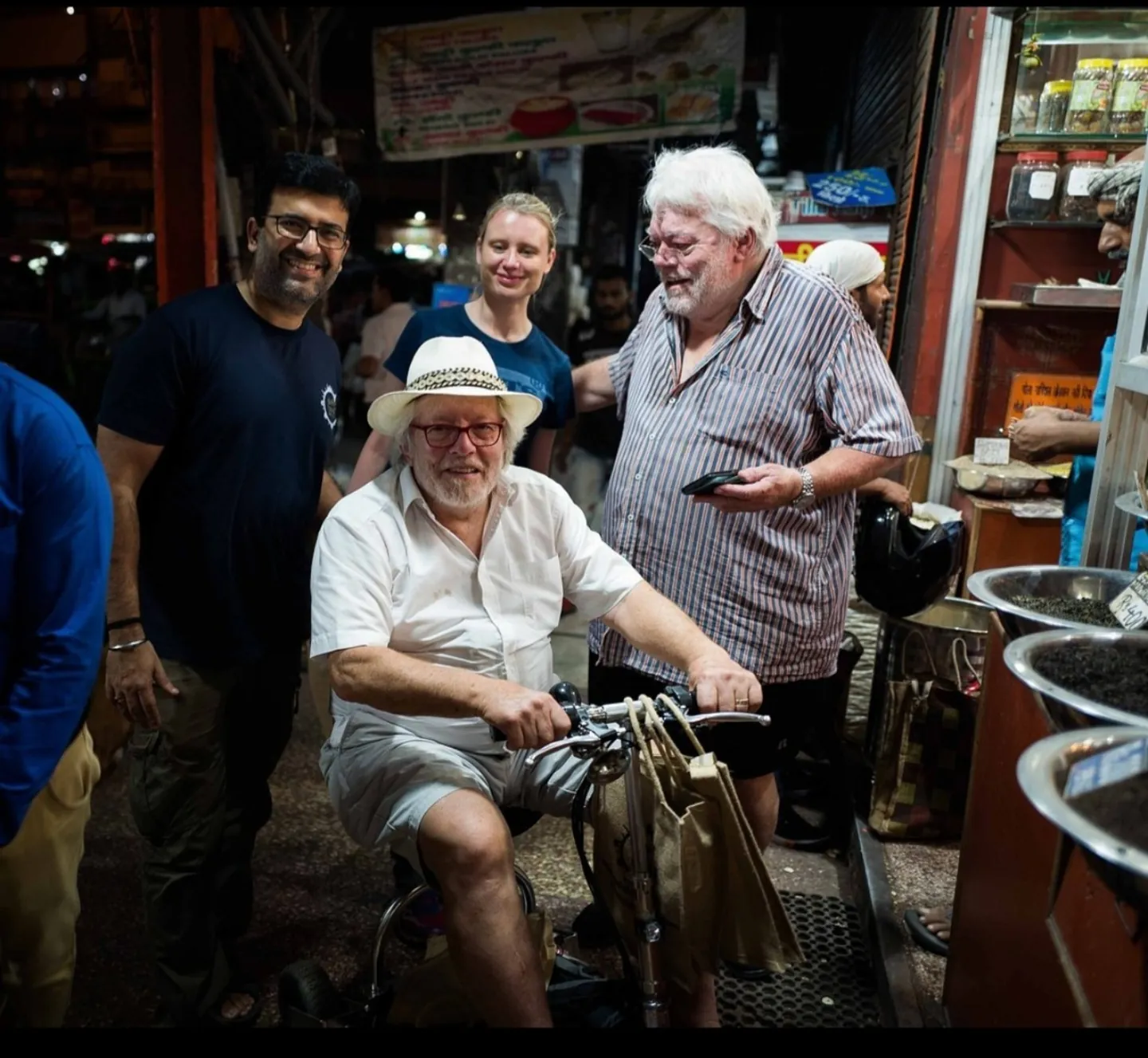 Travellers visiting an Old Delhi spice shop