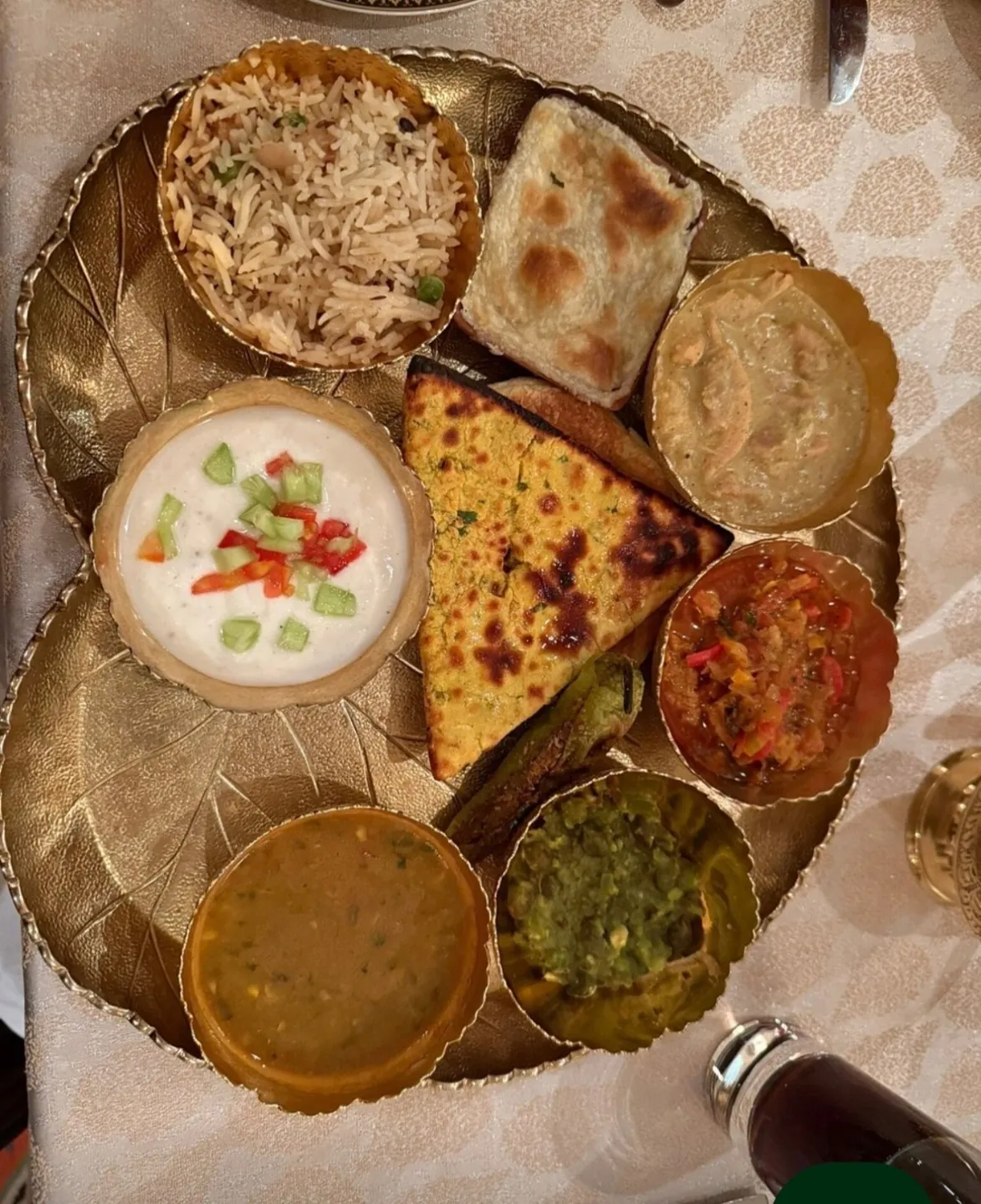 A selection of regional dishes served on a thali