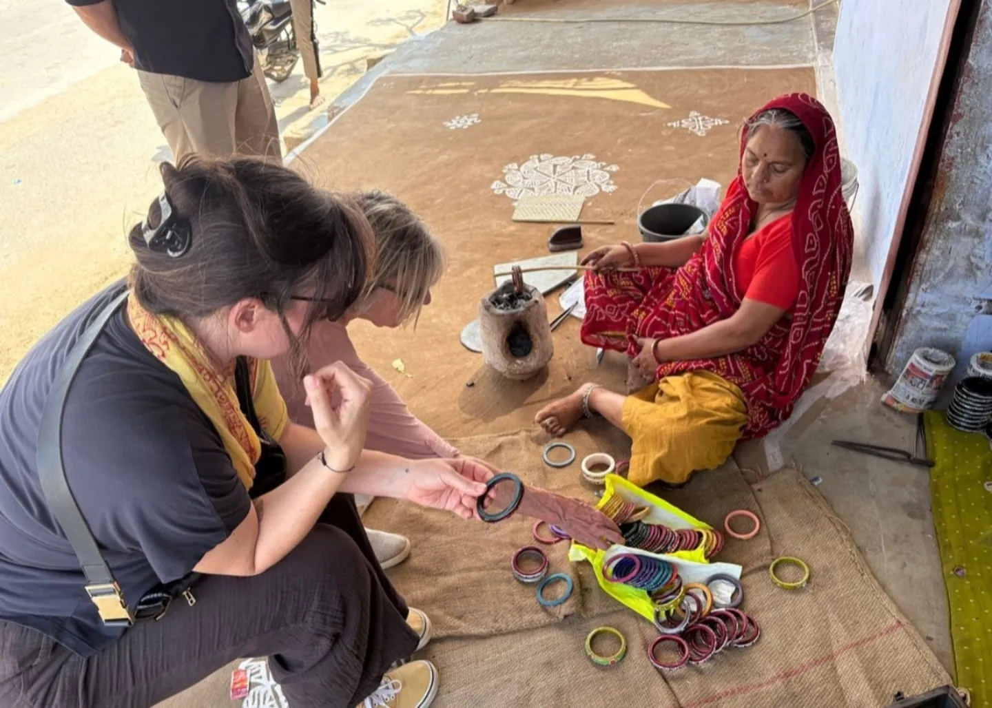A visitor watching a local craft demonstration