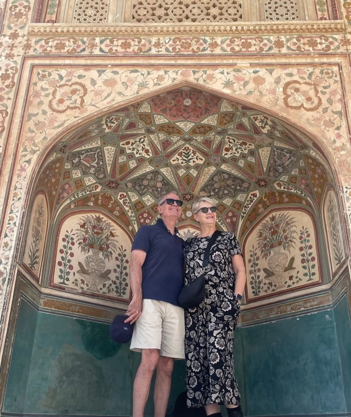 Visitors admiring painted architectural details