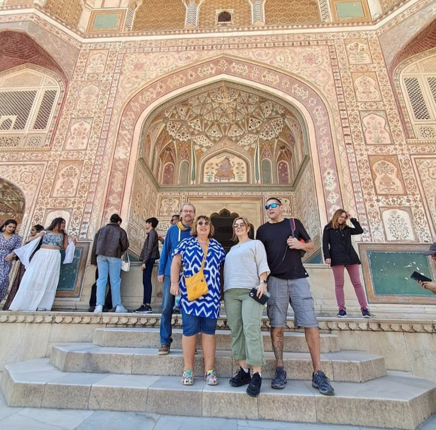 Travellers at a decorated gateway in Amber Fort, Jaipur