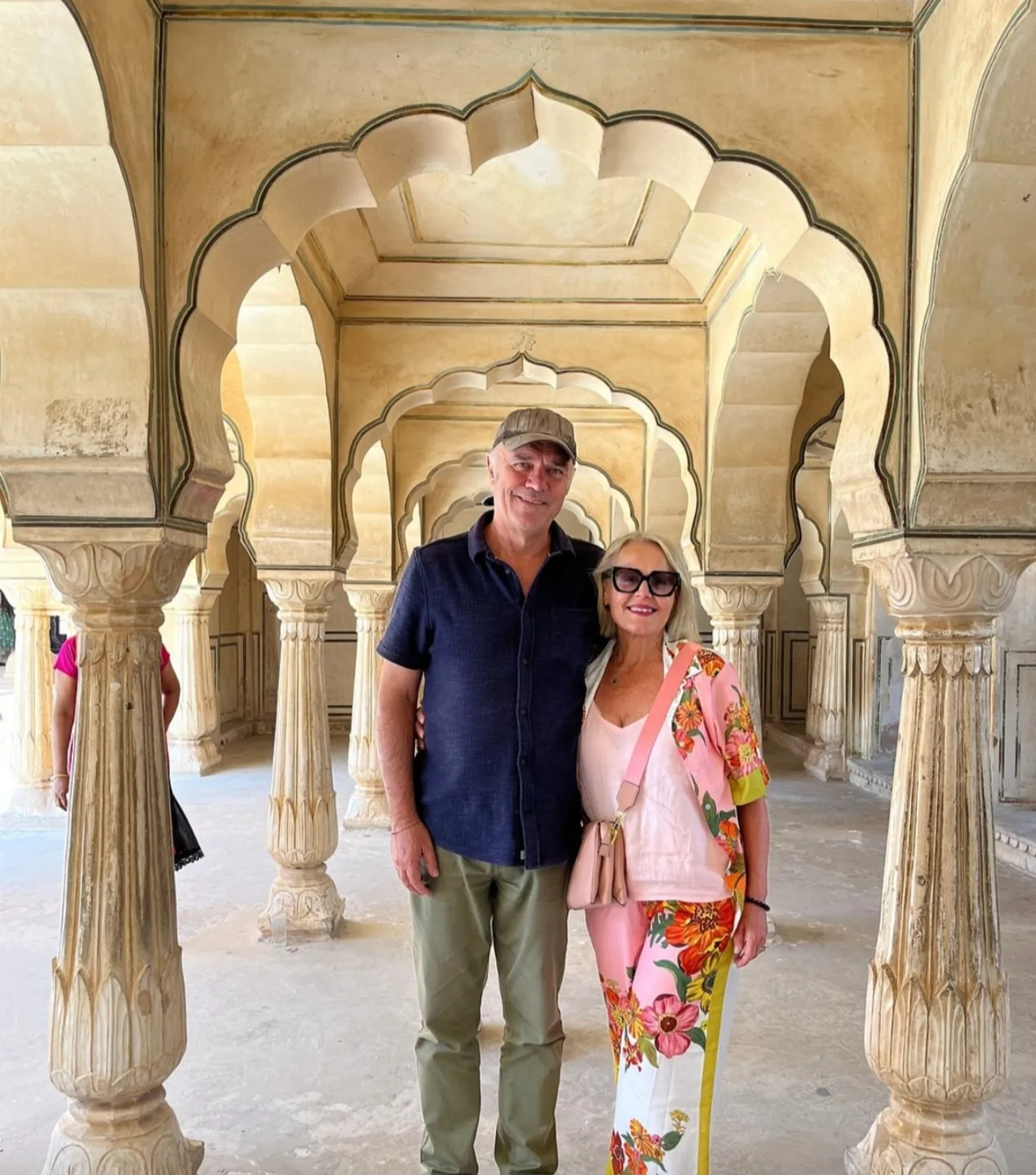 Visitors beneath the carved arches of Amber Fort