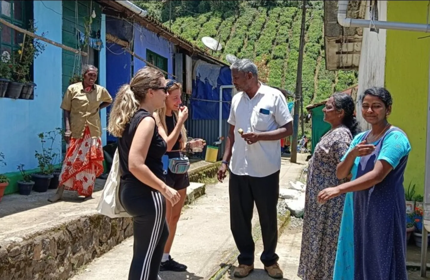 Travellers meeting residents in a tea-country village