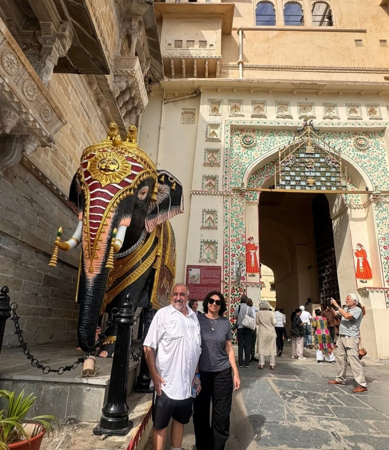 Visitors at the decorated entrance to City Palace, Udaipur