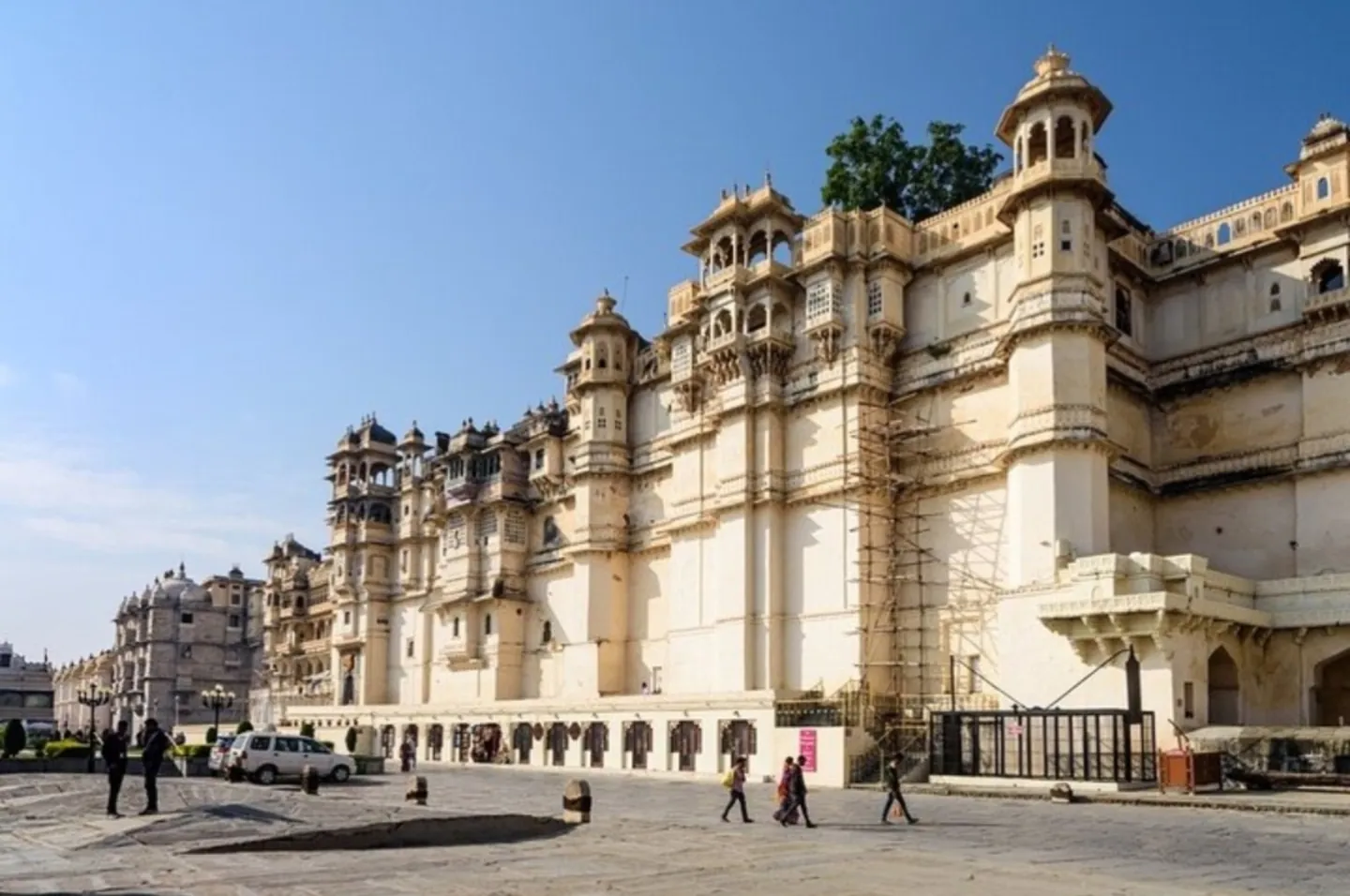 The sunlit exterior of City Palace in Udaipur