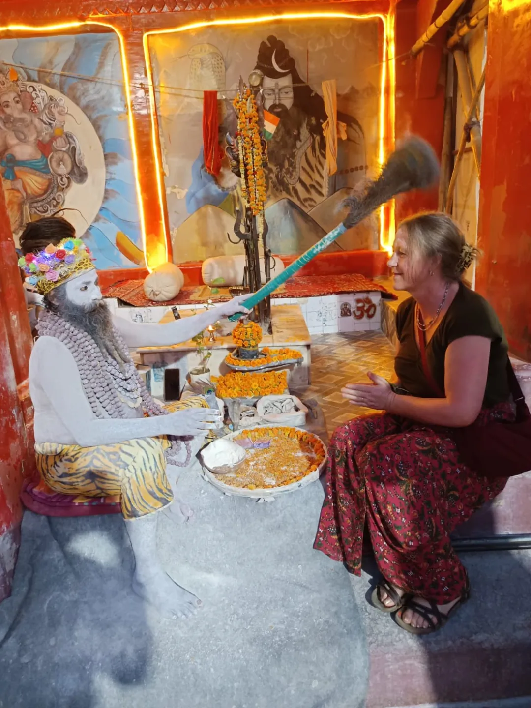 A visitor taking part in a prayer ceremony